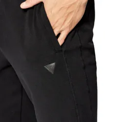 Pantalon jogging homme Guess Logo triangle classic Noir - ZESHOES Pantalon jogging homme Guess Logo triangle classic Noir - ZESHOES