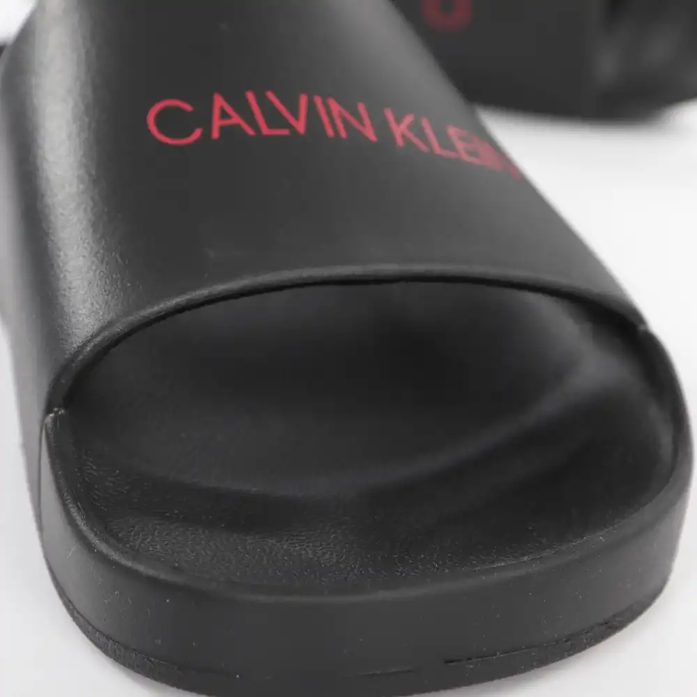 Claquette homme Calvin Klein Slide Noir - ZESHOES Claquette homme Calvin Klein Slide Noir - ZESHOES